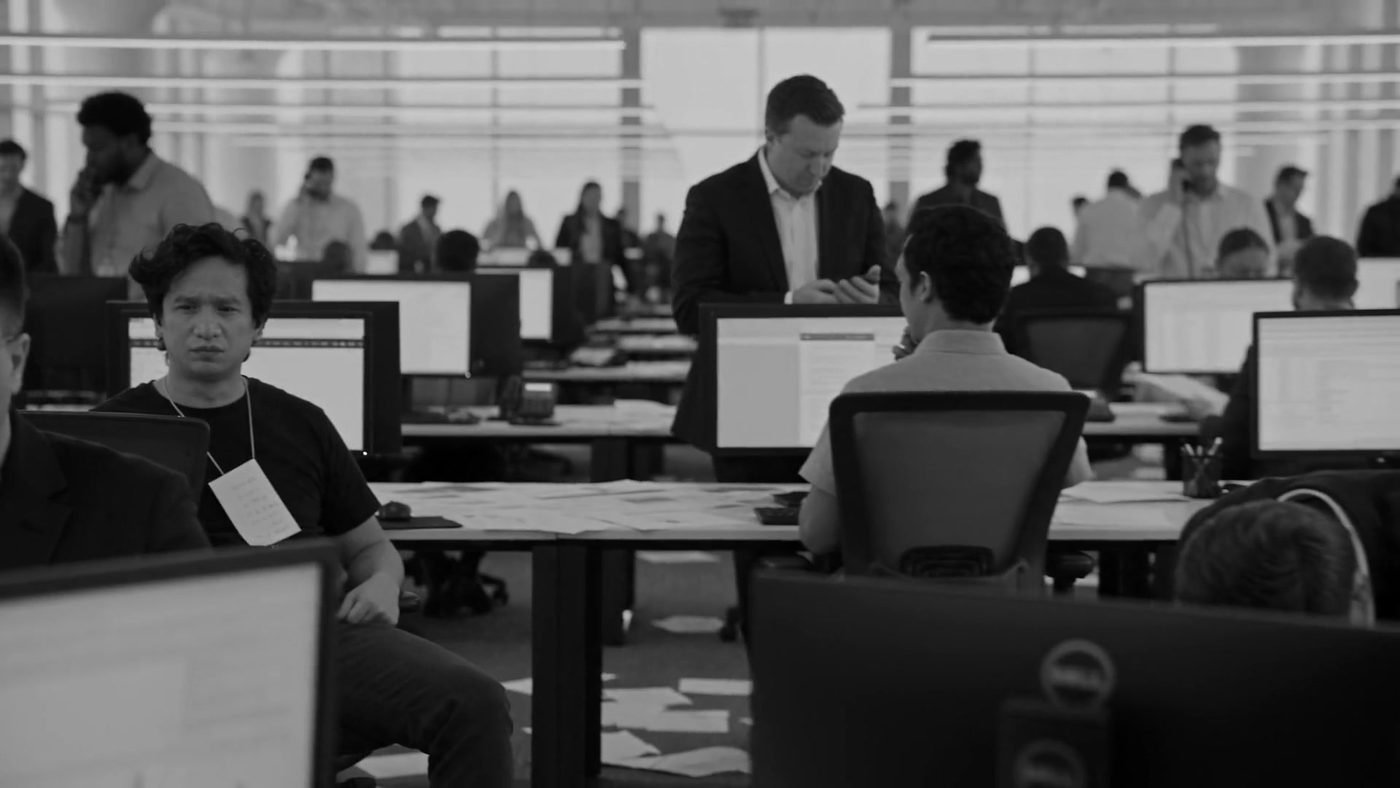 A busy agency sales floor with reps working their pipeline